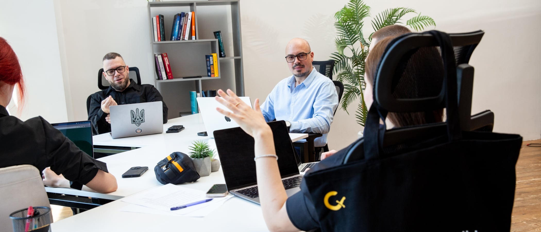 Leadership team engaged in discussion in the office