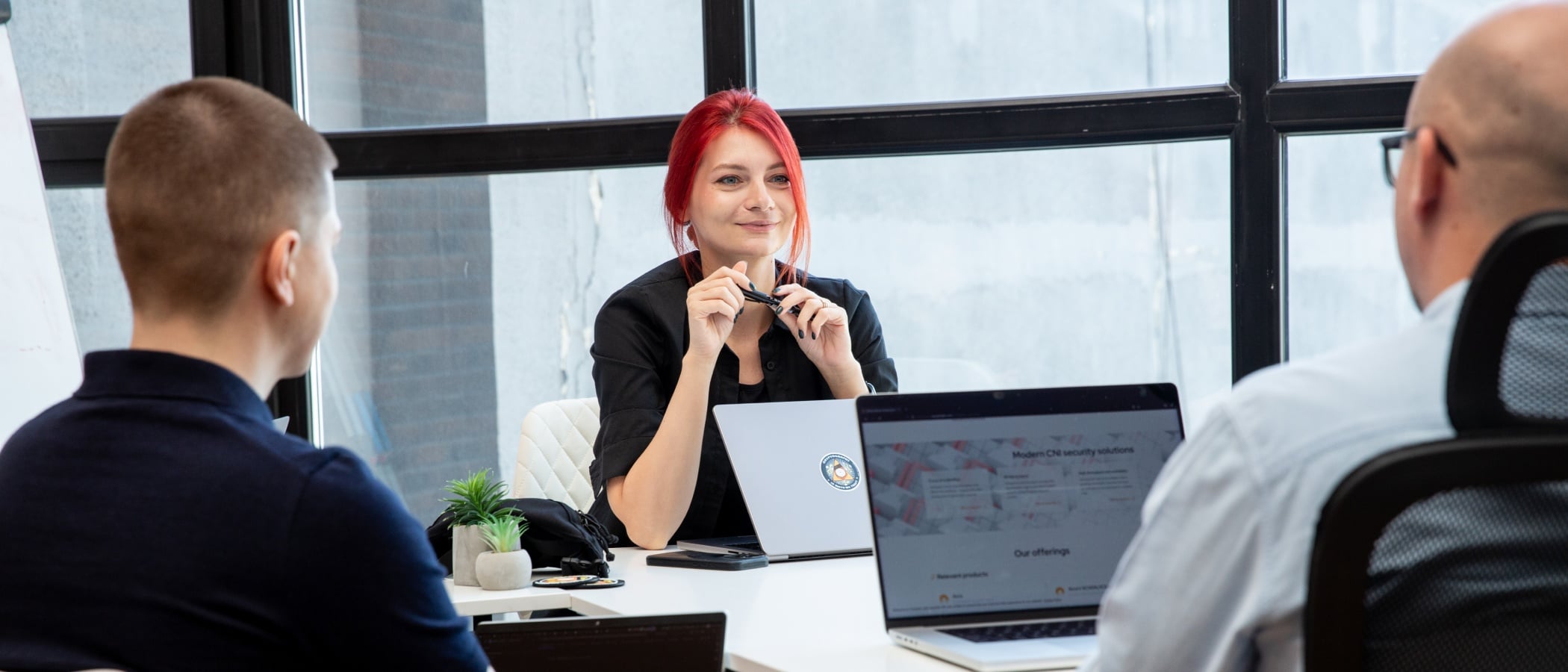 Head of Security Engineering discussing project plans with colleagues